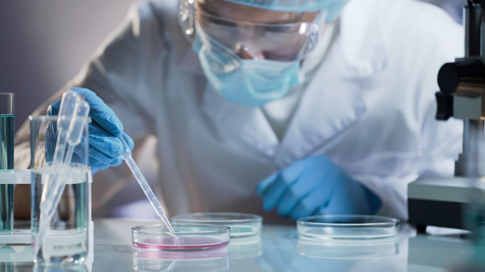 scientists separating cells in a research lab