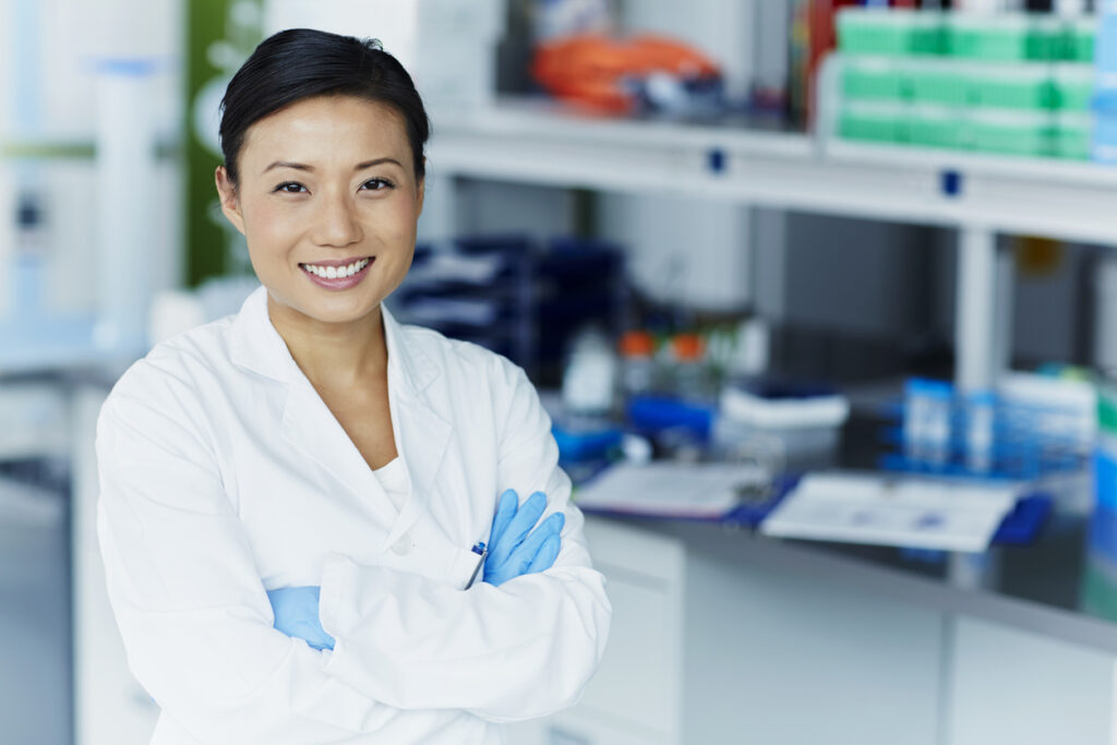 Portrait of confident female scientist helping to develop human b cell isolation kits