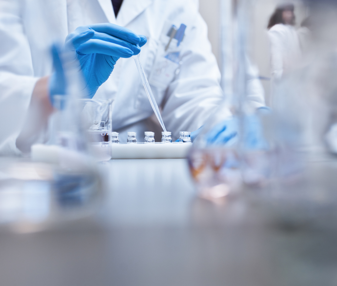 Scientist Holding a Vial in a Lab