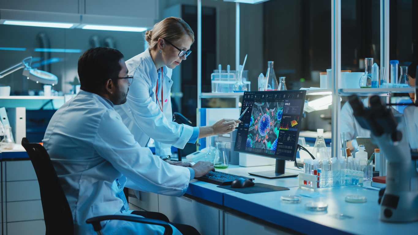 Scientists in a Lab Looking at Data on a Computer